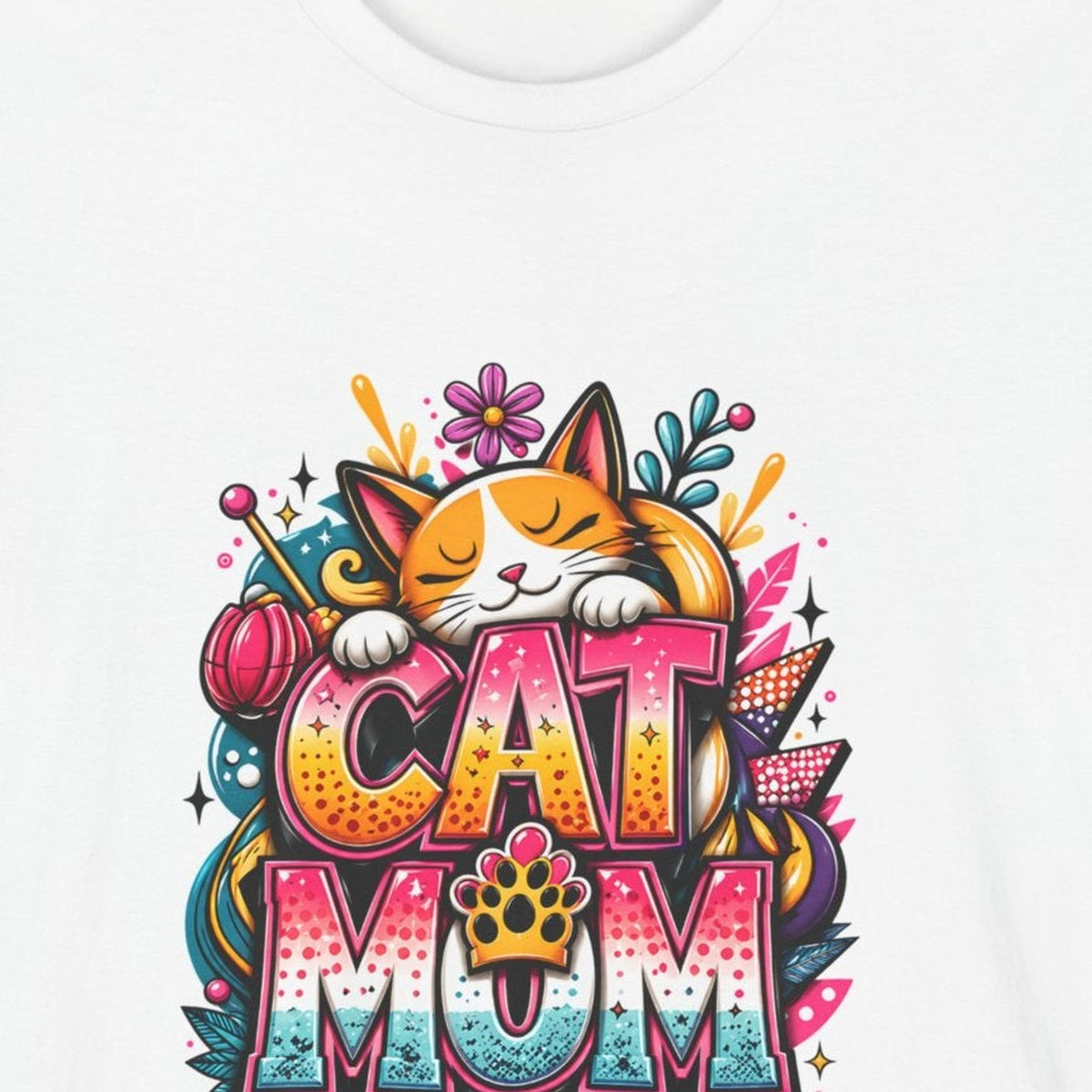 Close-up of the Cat Mom print: orange-and-white cat asleep on pink, orange, and teal graffiti letters, on the White tee
