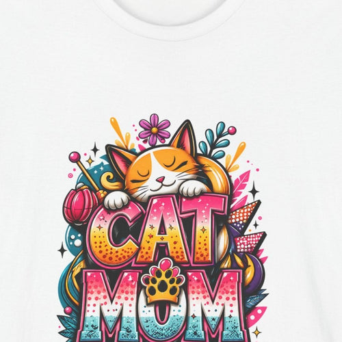 Close-up of the Cat Mom print: orange-and-white cat asleep on pink, orange, and teal graffiti letters, on the White tee